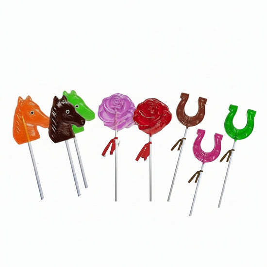 Set of colorful lollipops on sticks shaped like horses, roses, and horseshoes on a white background.