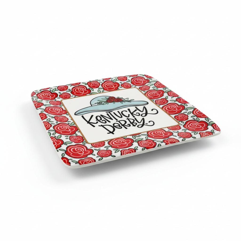 Decorative plate with red rose pattern and 'Kentucky Derby' text on a white background