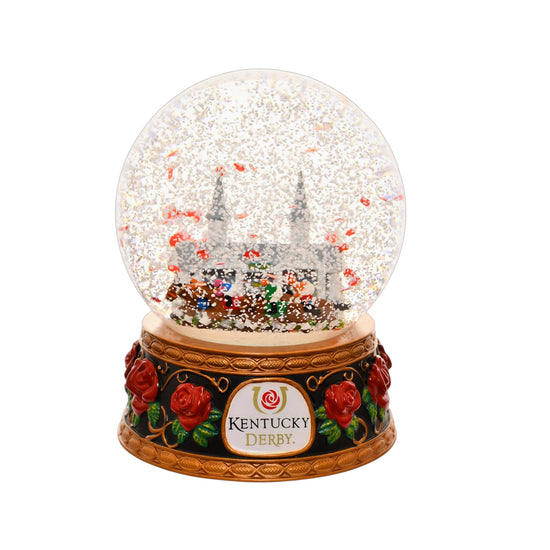 A close-up of the Kentucky Derby snow globe, with snow and red rose petals swirling around the racehorses.
