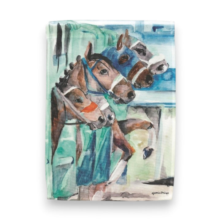 A colorful watercolor-style garden flag illustrating three brown racehorses with white facial markings waiting at the starting line, painted with impressionistic teal, green, and blue brushstrokes.
