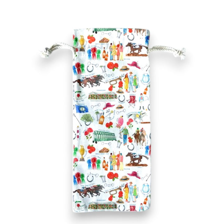 A natural canvas drawstring gift bag with a Kentucky Derby horse racing theme, shown holding a bottle of wine.