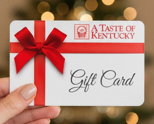 Gift card with red ribbon and 'A Taste of Kentucky' logo held against a blurred background