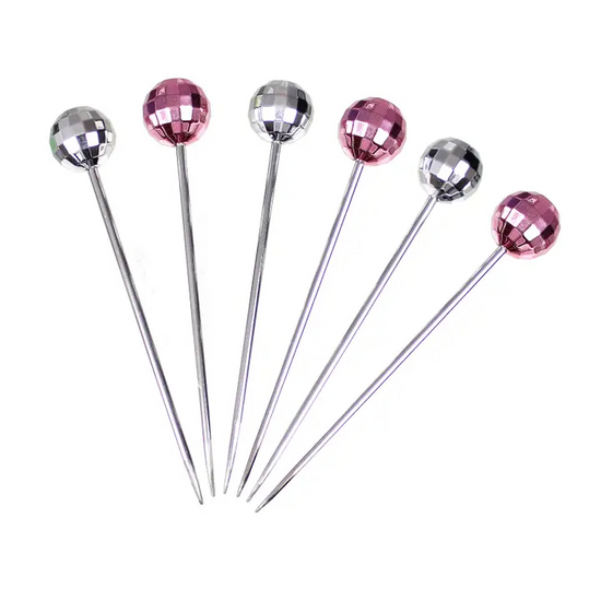 Full set of six disco ball cocktail picks, showing three pink and three silver.