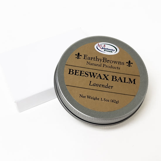 Beeswax balm container with brown label on a white background