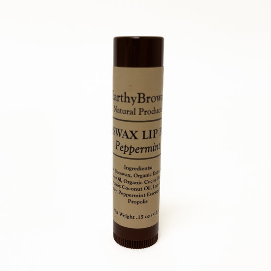 Beeswax lip balm stick with 'Earthy Brown' branding on a white background