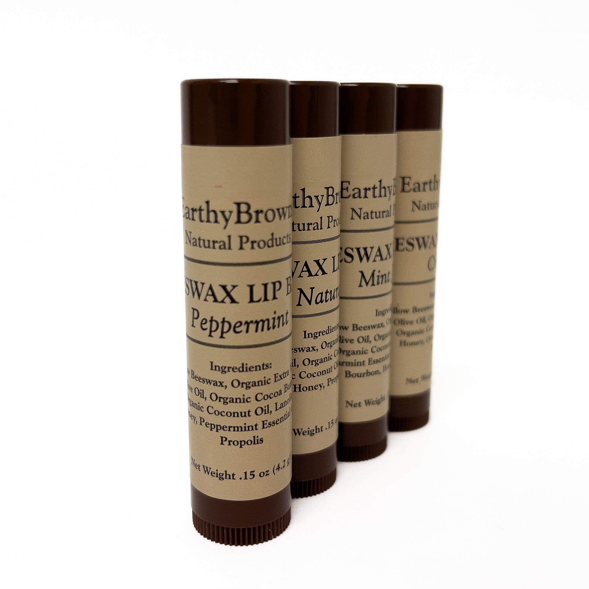 Four Earthy Brown Natural Products lip balm tubes on a white background