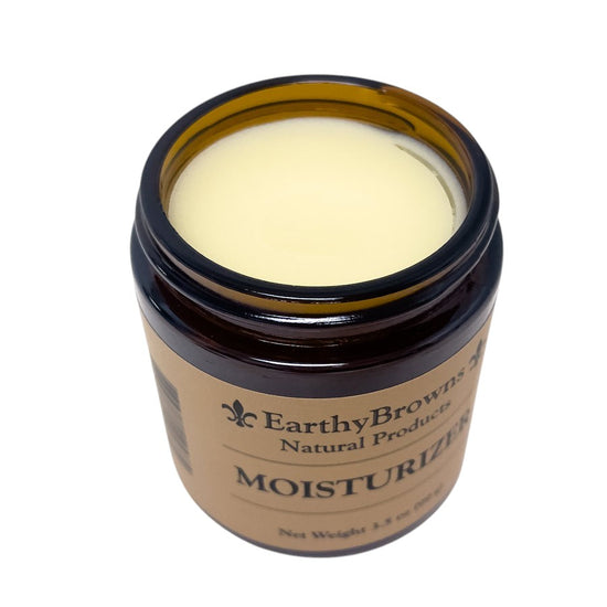 Jar of Earthy Browns Natural Products moisturizer on a white background