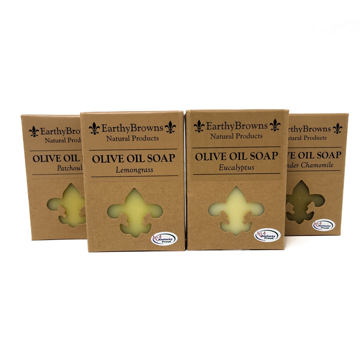 Four boxes of Earthy Browns Olive Oil Soap on a white background