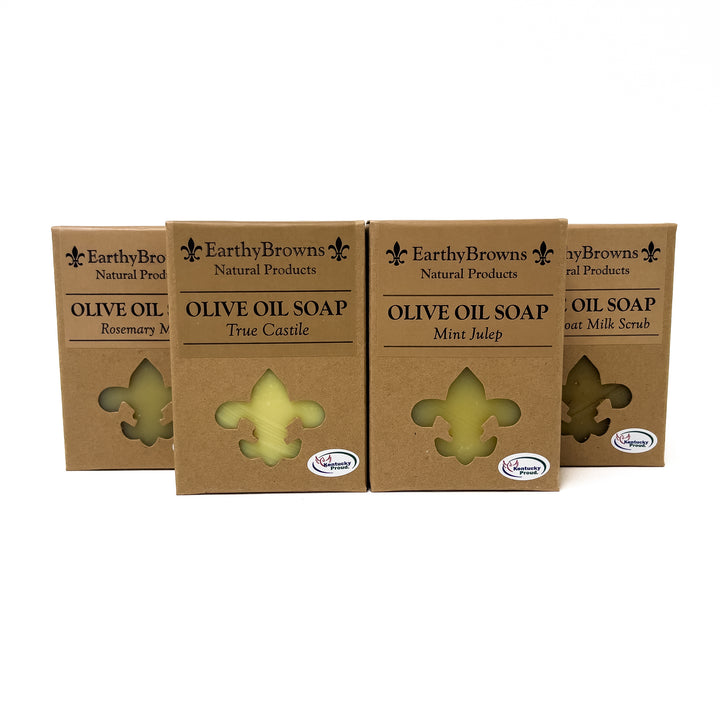 Four boxes of Earthy Browns Olive Oil Soap on a white background