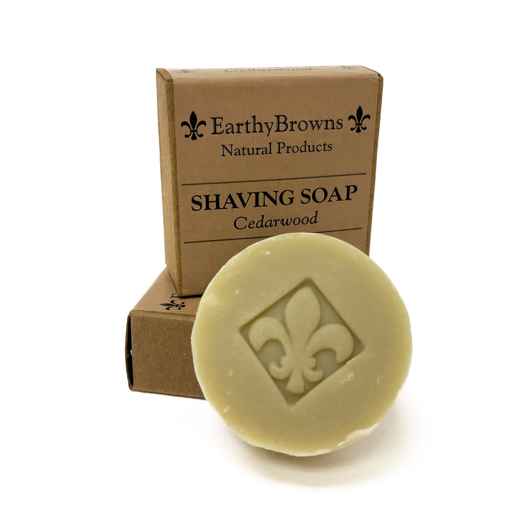 Shaving soap bar with fleur-de-lis design and Earthy Browns packaging on a white background
