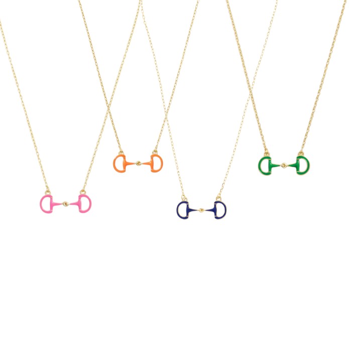 A group shot of the Eclipse Enamel Horsebit Necklace showcasing all four available colors: Navy, Orange, Green, and Pink.