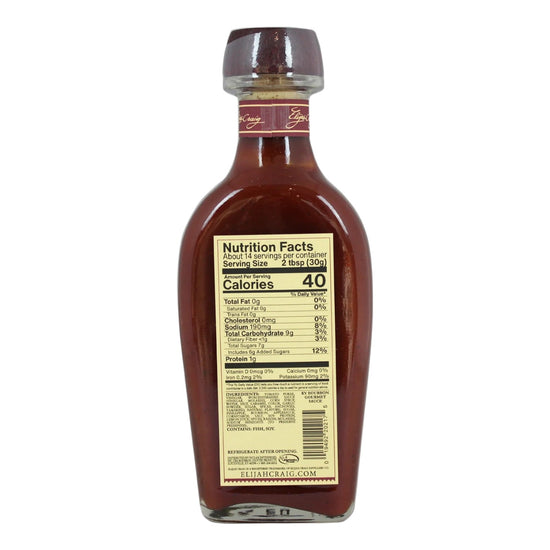 Bottle of syrup with nutrition facts label on a white background