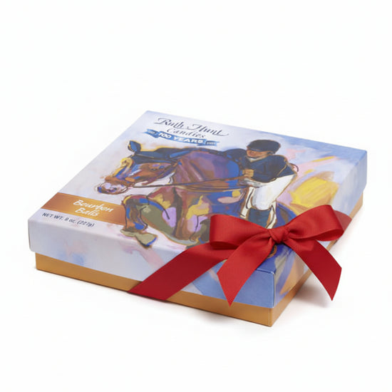 Detailed view of the horse-themed artwork on the elegant gift box.