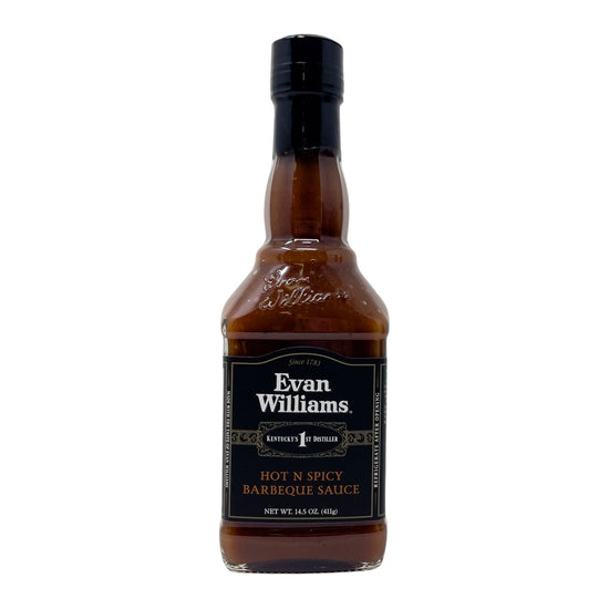 Bottle of Evan Williams hot n spicy barbecue sauce on a white background
