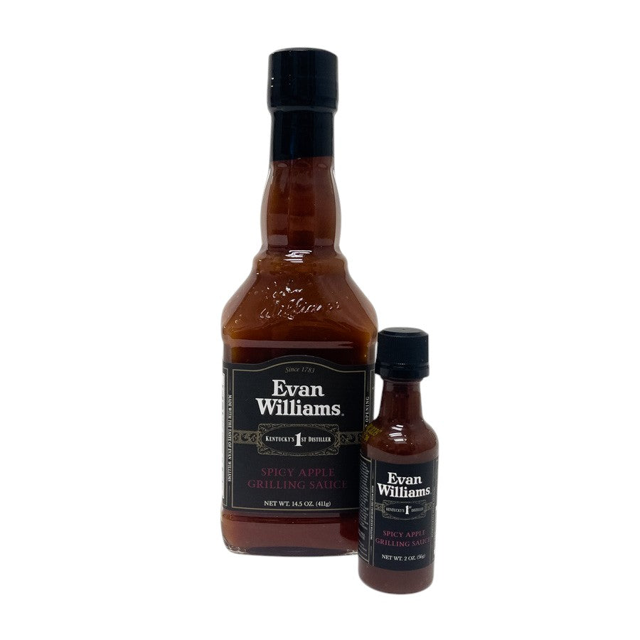 Two bottles of Evan Williams spicy apple grilling sauce on a white background