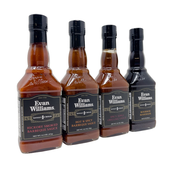 Four bottles of Evan Williams barbecue sauce on a white background