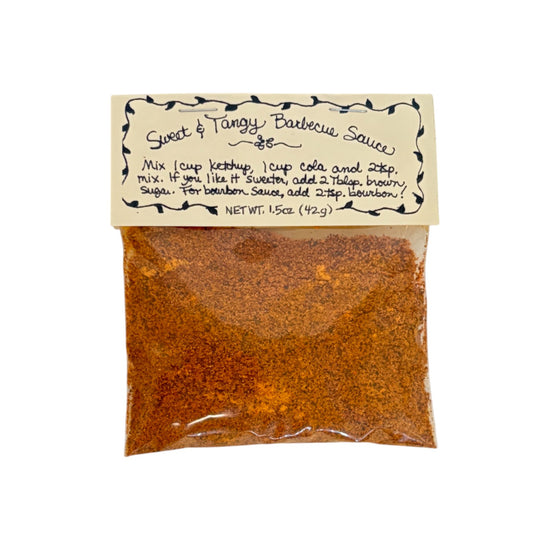 A packet of Flag Fork Herb Farm's Sweet & Tangy Barbecue Sauce Mix on a white background.