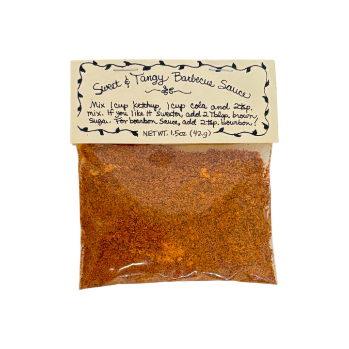 A packet of Flag Fork Herb Farm's Sweet & Tangy Barbecue Sauce Mix on a white background.