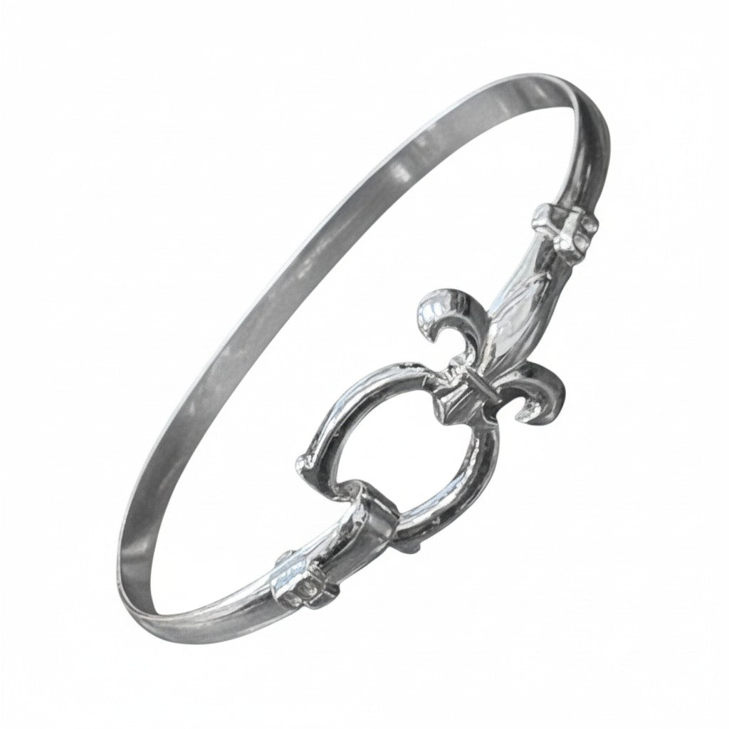 The elegant sterling silver bracelet featuring a detailed fleur-de-lis design.