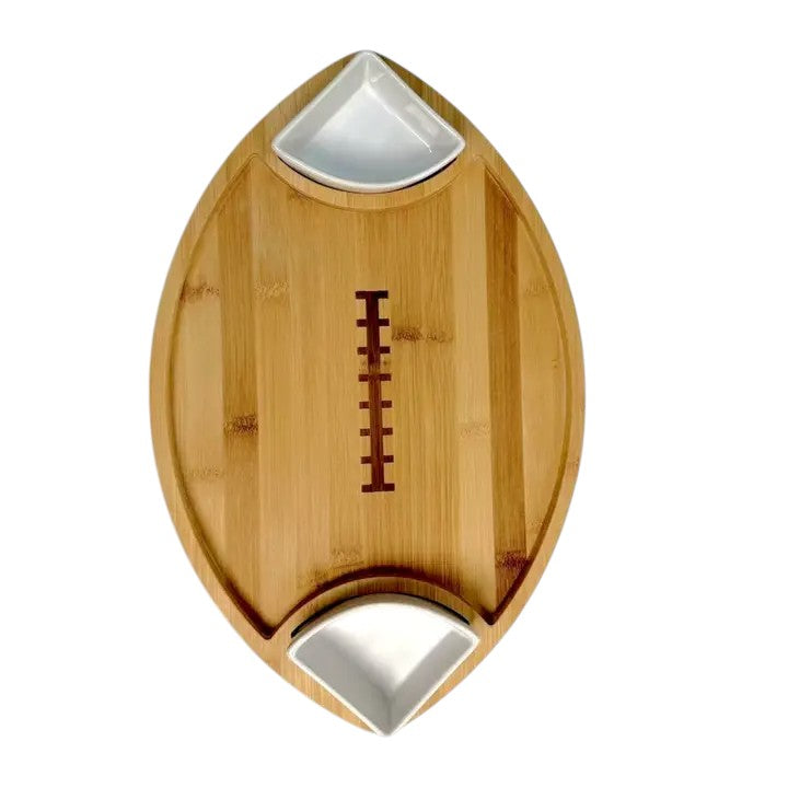 Wooden football-shaped cutting board with bottle openers on a white background