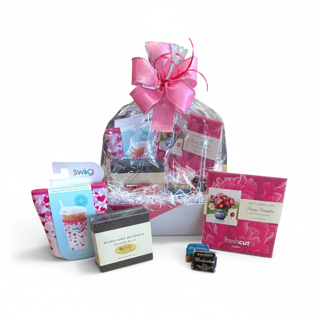 The Galentine's Gift Basket featuring a pink Swig Coolie, 3D card, and chocolates in a festive arrangement.