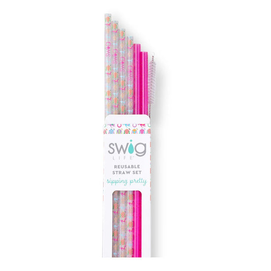 Packaged set of reusable straws with colorful patterns and pink accents, branded 'Swig'.