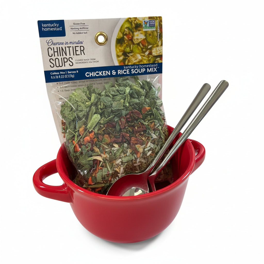 Close-up detail of the hearty soup mix packet next to the two ceramic bowls and spoons.