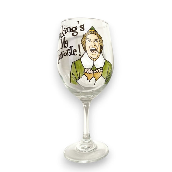 A stemmed wine glass featuring a hand-painted design of Buddy the Elf.