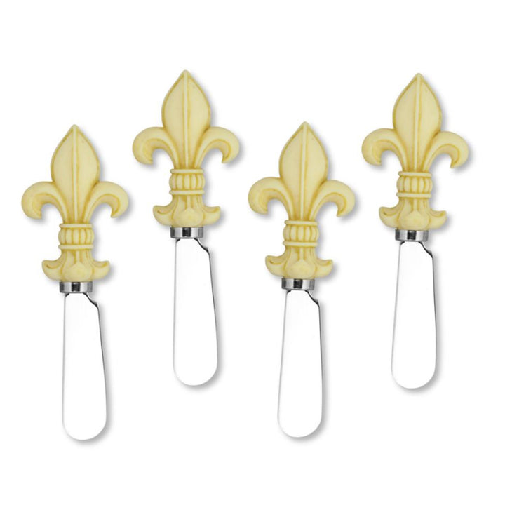 Four cheese knives with fleur-de-lis handles on a white background