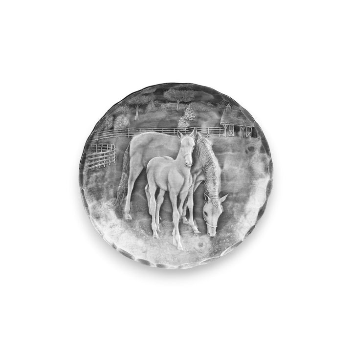 A top-down view of the handcrafted aluminum horse coaster, showcasing the detailed, textured horse design.