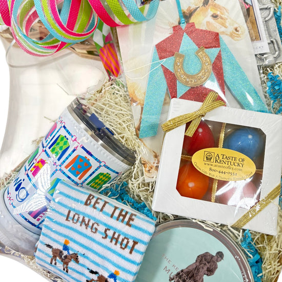Assorted gift items including a candle, snack pack, and decorative items with horse-themed packaging.