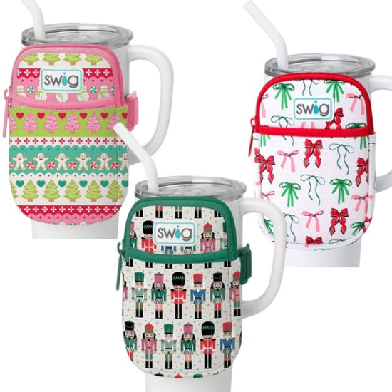 display of Swig holiday 40oz Mega Mug pouch accessories in Ribbons & Bows, Classic Nutcracker, and Cookie Jar prints.