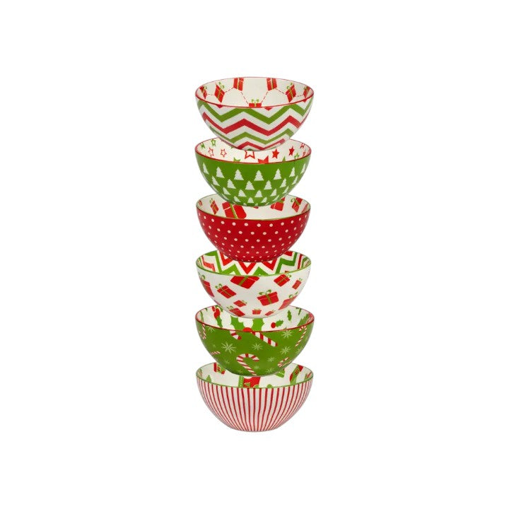 Set of five decorative bowls with Christmas patterns stacked on a white background