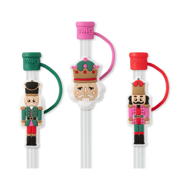 Set of three Classic Nutcracker themed straw toppers, including two soldier figures and a crown from Swig