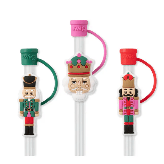 Set of three Classic Nutcracker themed straw toppers, including two soldier figures and a crown from Swig