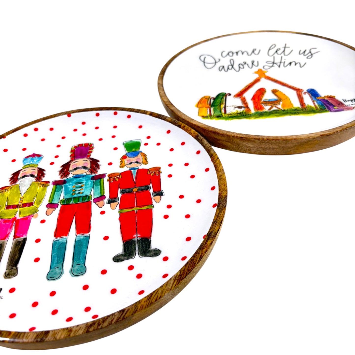 Two decorative plates with Christmas designs on a white background