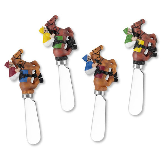 Four cheese Spreaders with horse and rider design on a white background