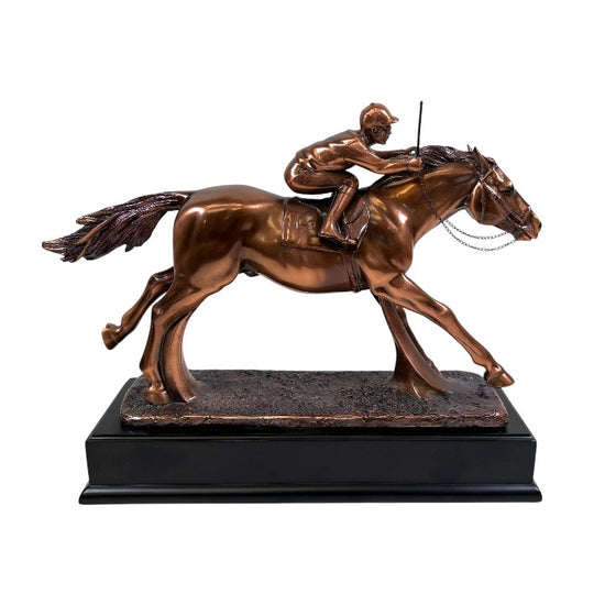 Copper sculpture of a horse and rider on a white background