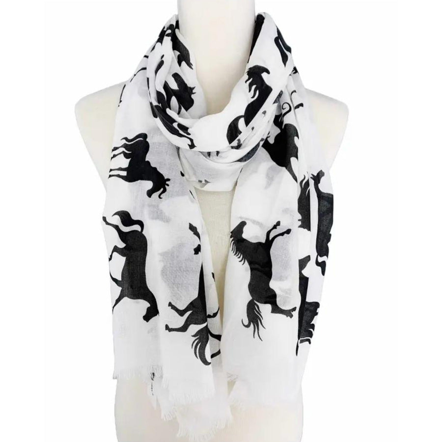 White scarf with black horse patterns on a mannequin against a white background