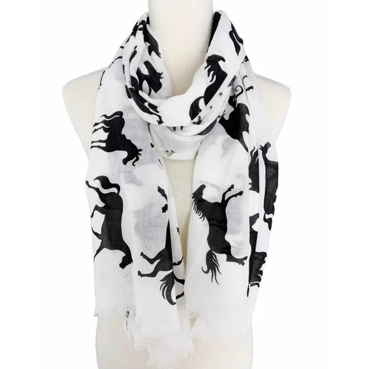 White scarf with black horse patterns on a mannequin against a white background