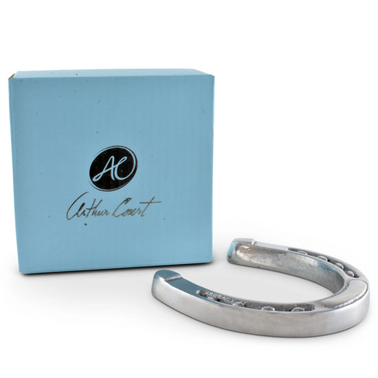 Silver horseshoe with a blue box featuring 'Arthur Court' branding on a white background