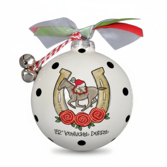 Decorative Christmas ornament with horse and horseshoe design on a white background