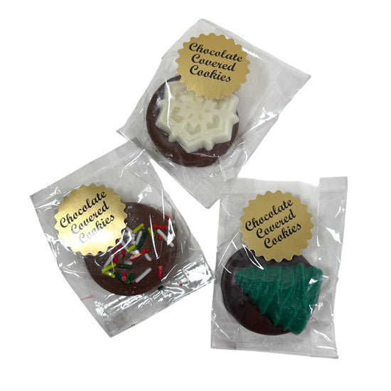 Three packages of chocolate-covered cookies with decorative toppings on a white background