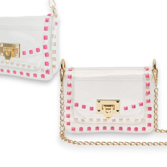 Clear handbag with pink accents and gold chain strap on a white background