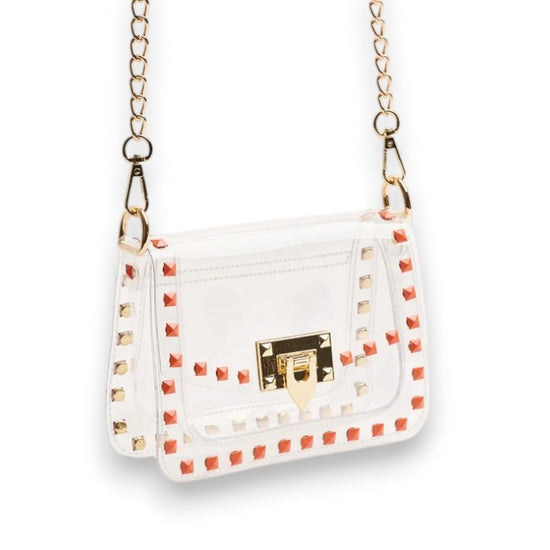 The Jackie clear crossbody purse showcasing its vibrant orange trim and sleek, structured design.
