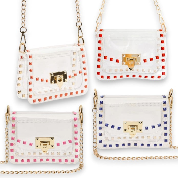 Four clear handbags with colorful studded accents on a white background