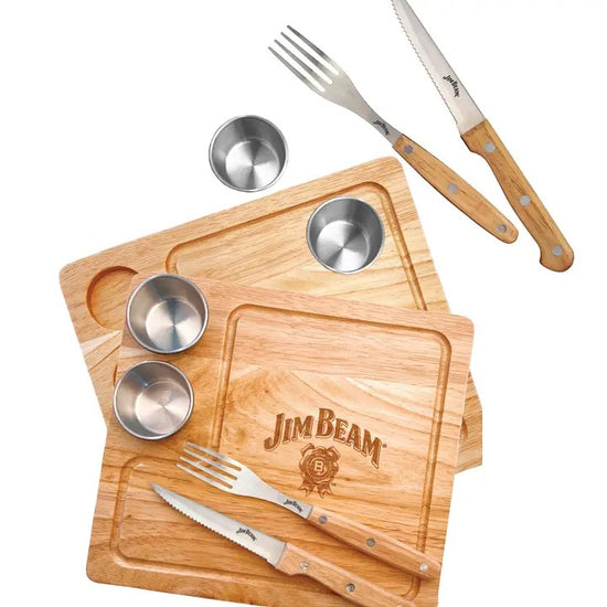 The complete Jim Beam 2-Pack Steak Serving Set, including two wood boards, knives, forks, and sauce cups.