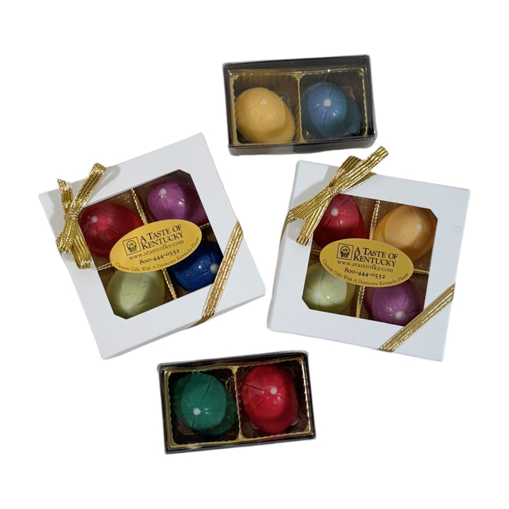 Colorful chocolate jockey caps in small boxes with 'A Taste of Kentucky' label on a white background