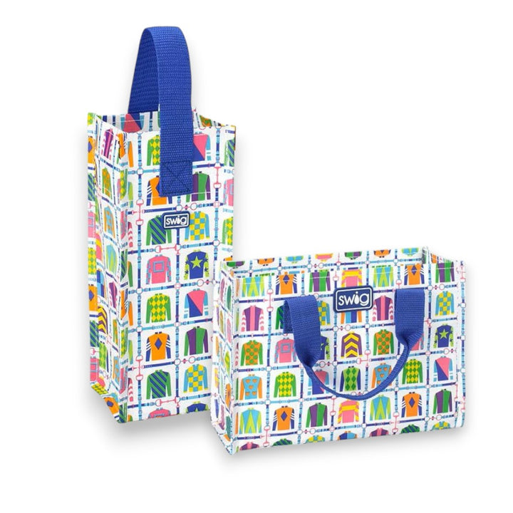 Two colorful Jockey Club reusable gift bags with blue handles on a white background