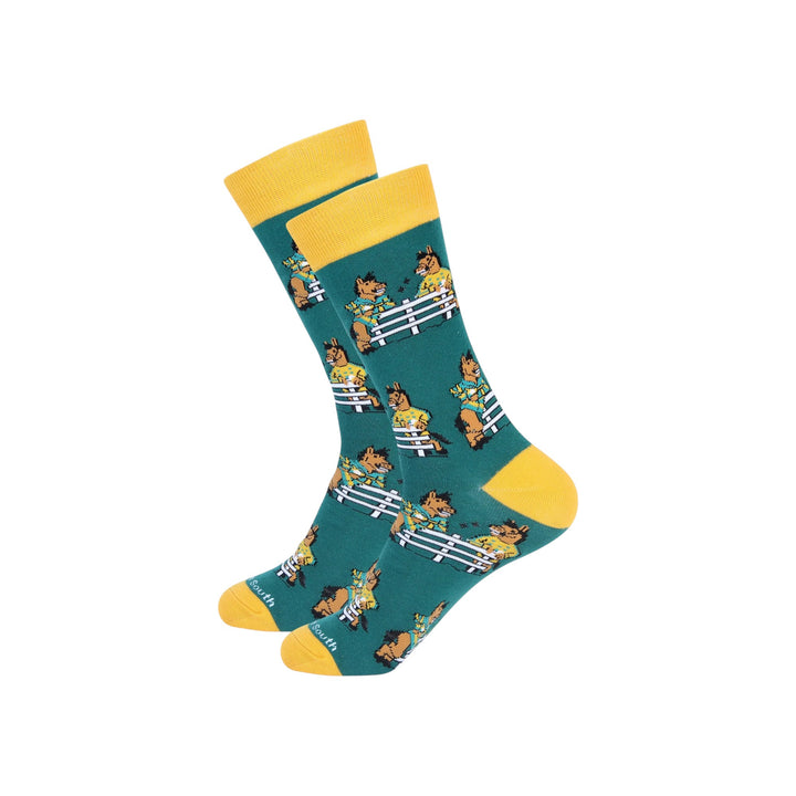 Teal sock with yellow accents featuring cartoon character pattern on a white background